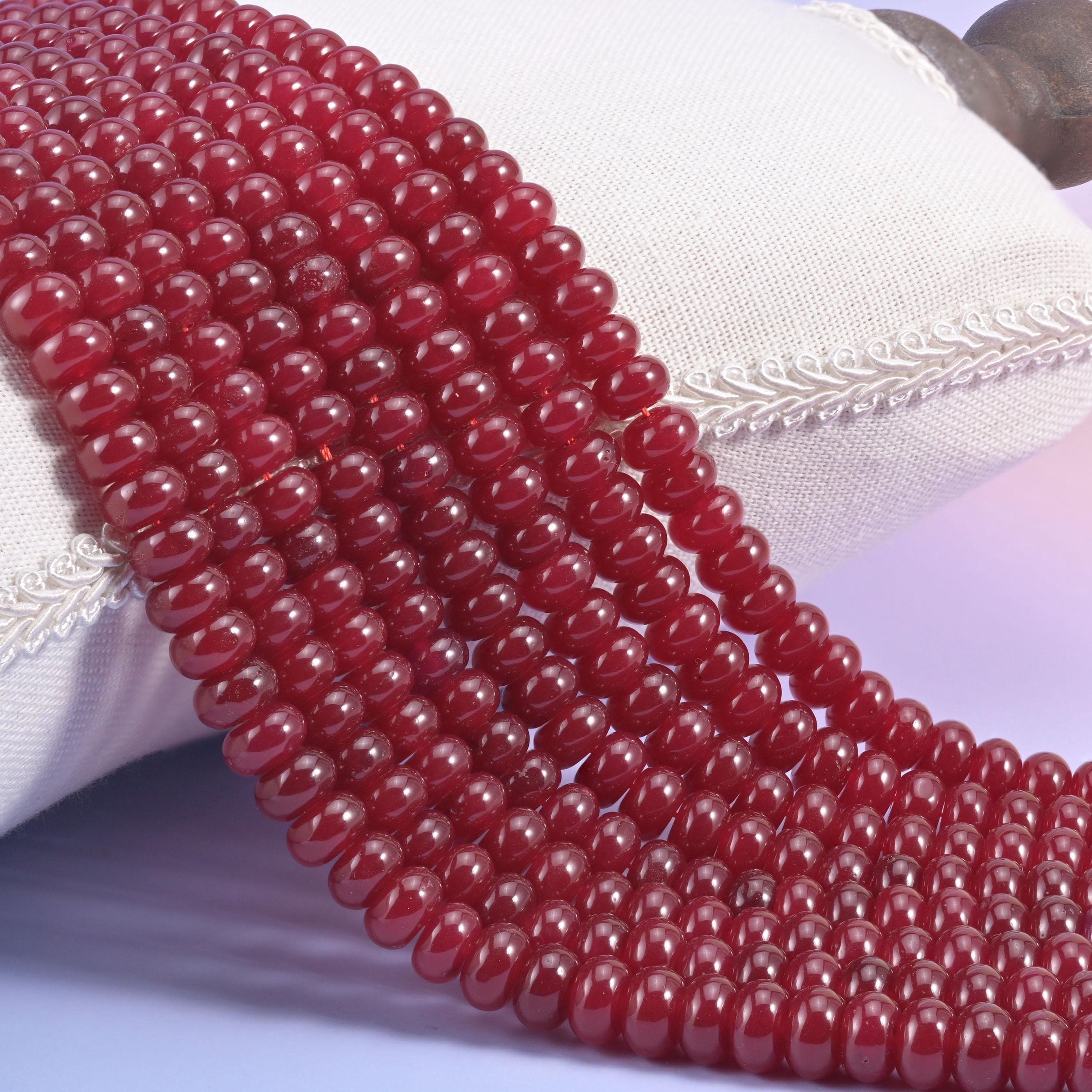 Ruby Red Dyed Jade smooth rondelle beads in a deep, glossy wine-red