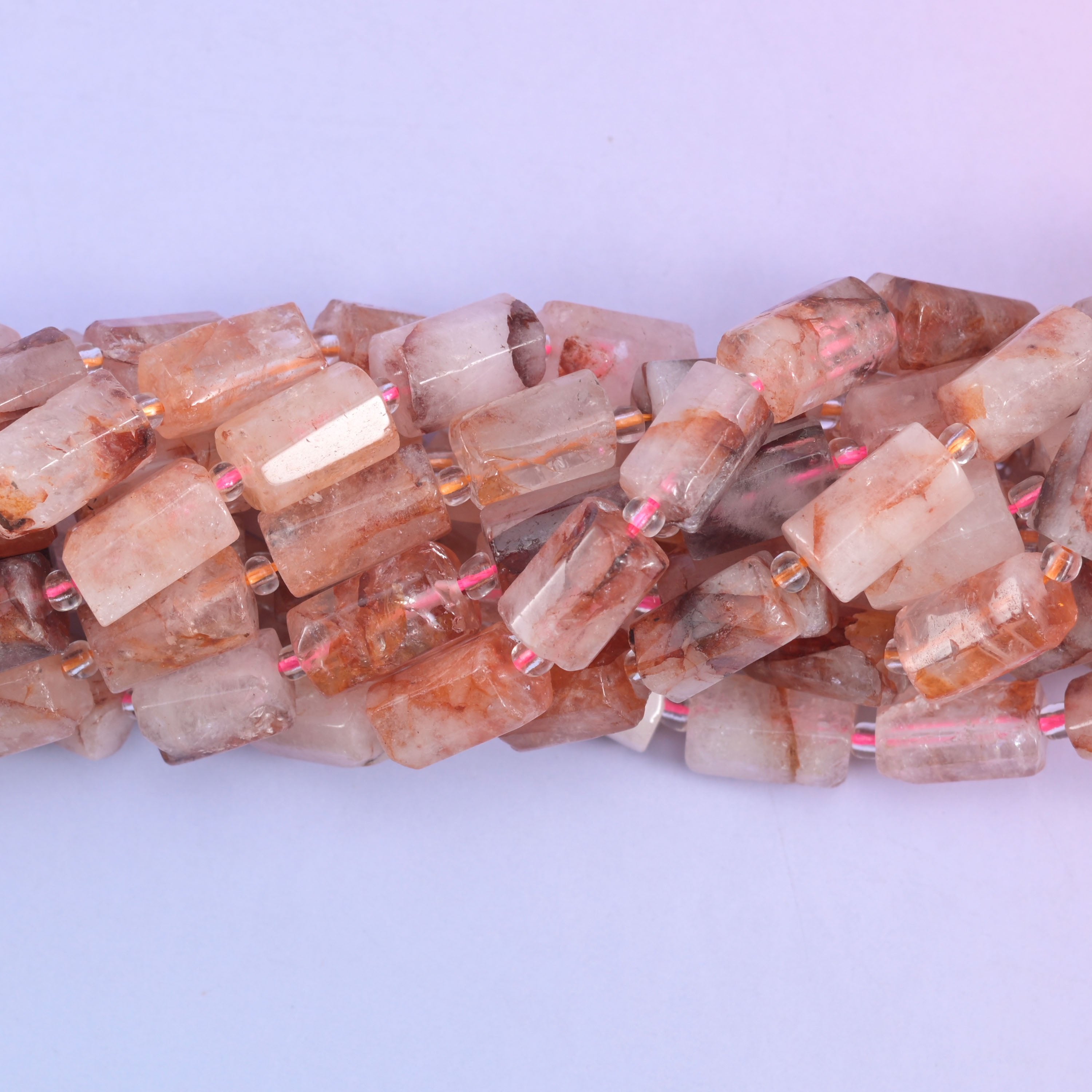 Faceted tube cut red hematoid beads