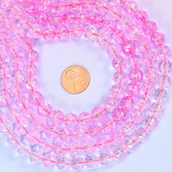 Transparent pink faceted round glass beads, approximately 42 beads per strand