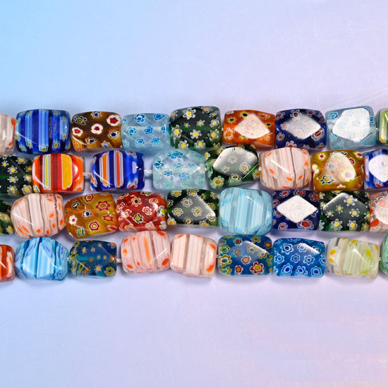 Millefiori cuboid beads with tiny flower rosettes, candy stripes and colour blocks on each face.