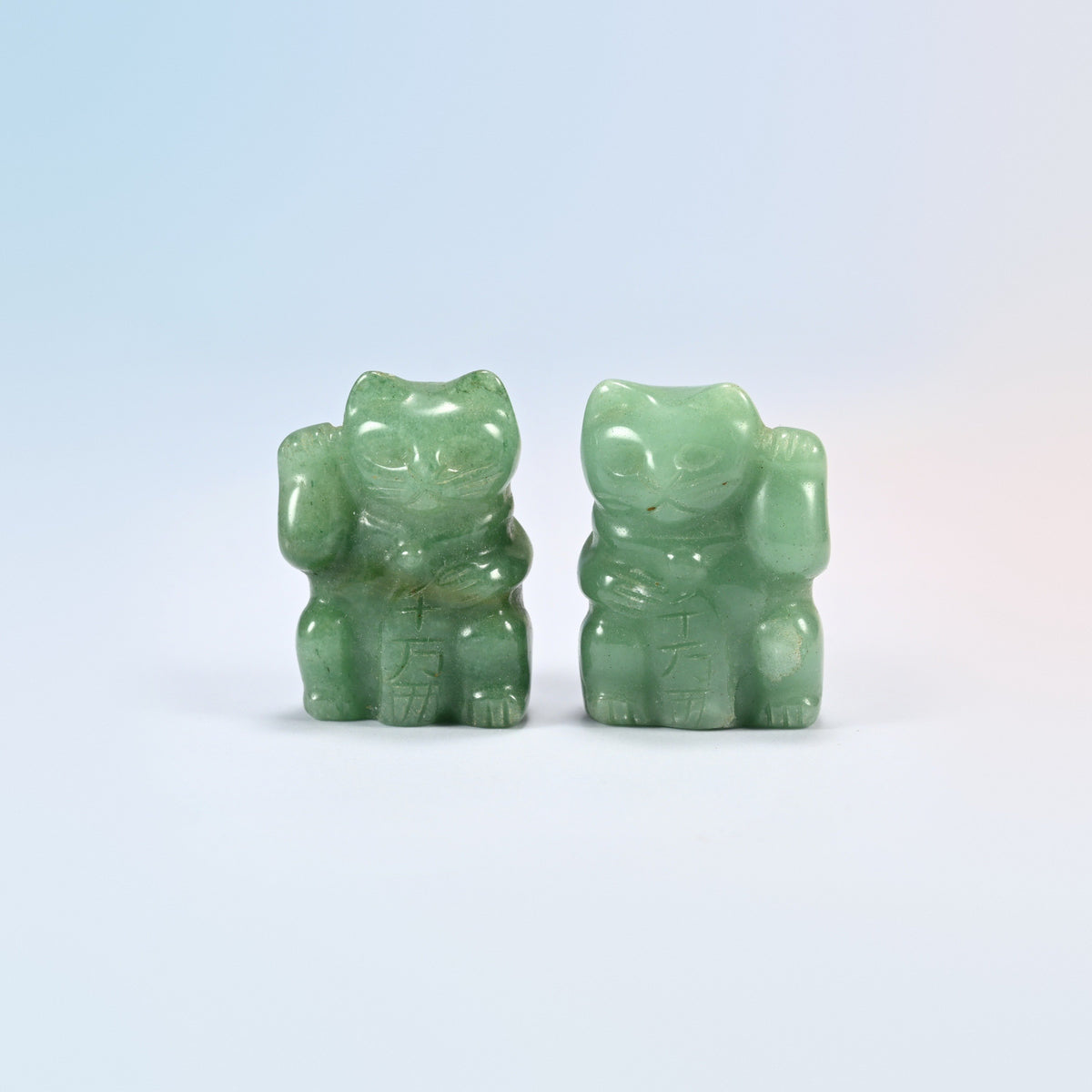 Two natural green aventurine lucky cat crystal carvings, 1.5 inch, holding a carved plaque