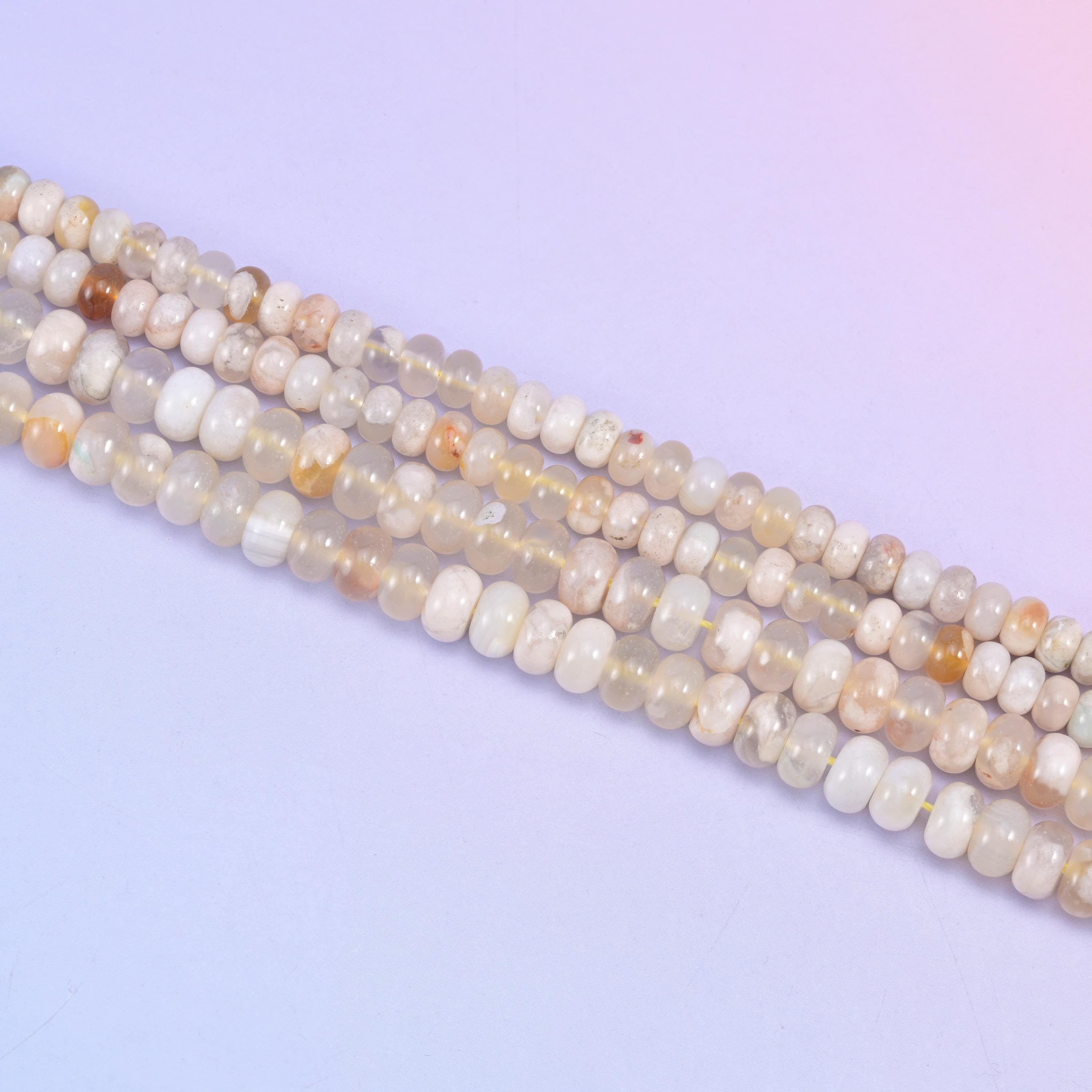 Sakura Agate rondelle beads in cream, translucent white, and golden-peach tones