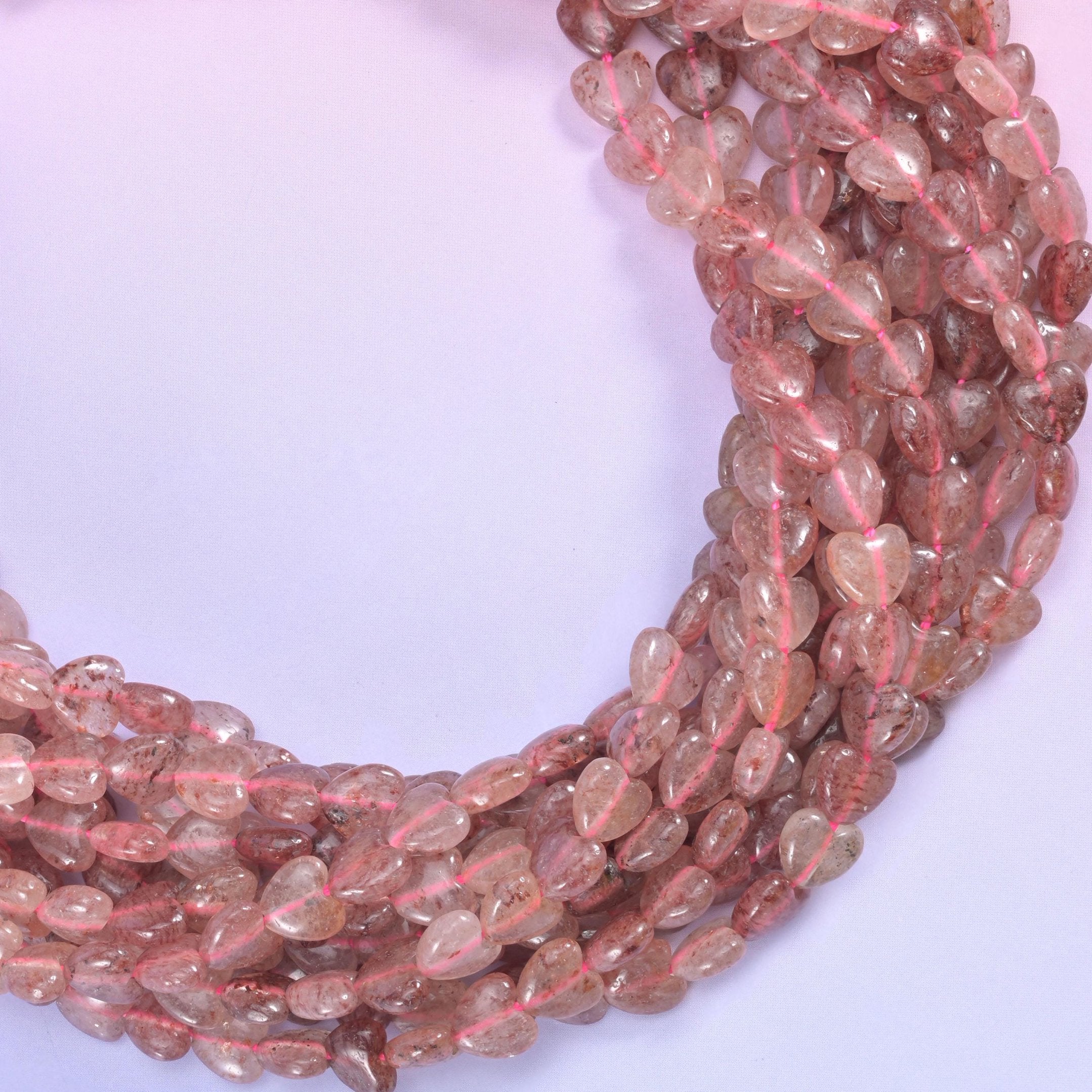 Strawberry Quartz Heart Beads, translucent dusty rose threaded with fine rust-red inclusions