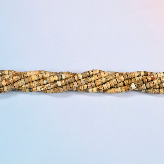 Strands of picture jasper faceted heishi disc beads twisted together in a horizontal row