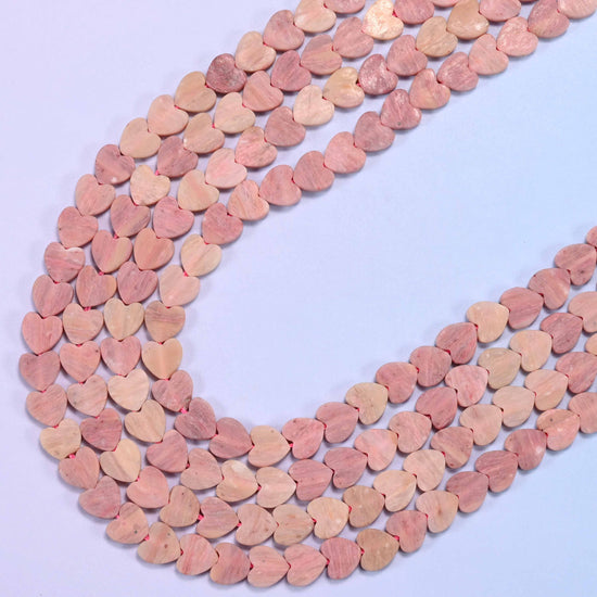Matte pink rhodonite flat heart beads, 15 inch strand
