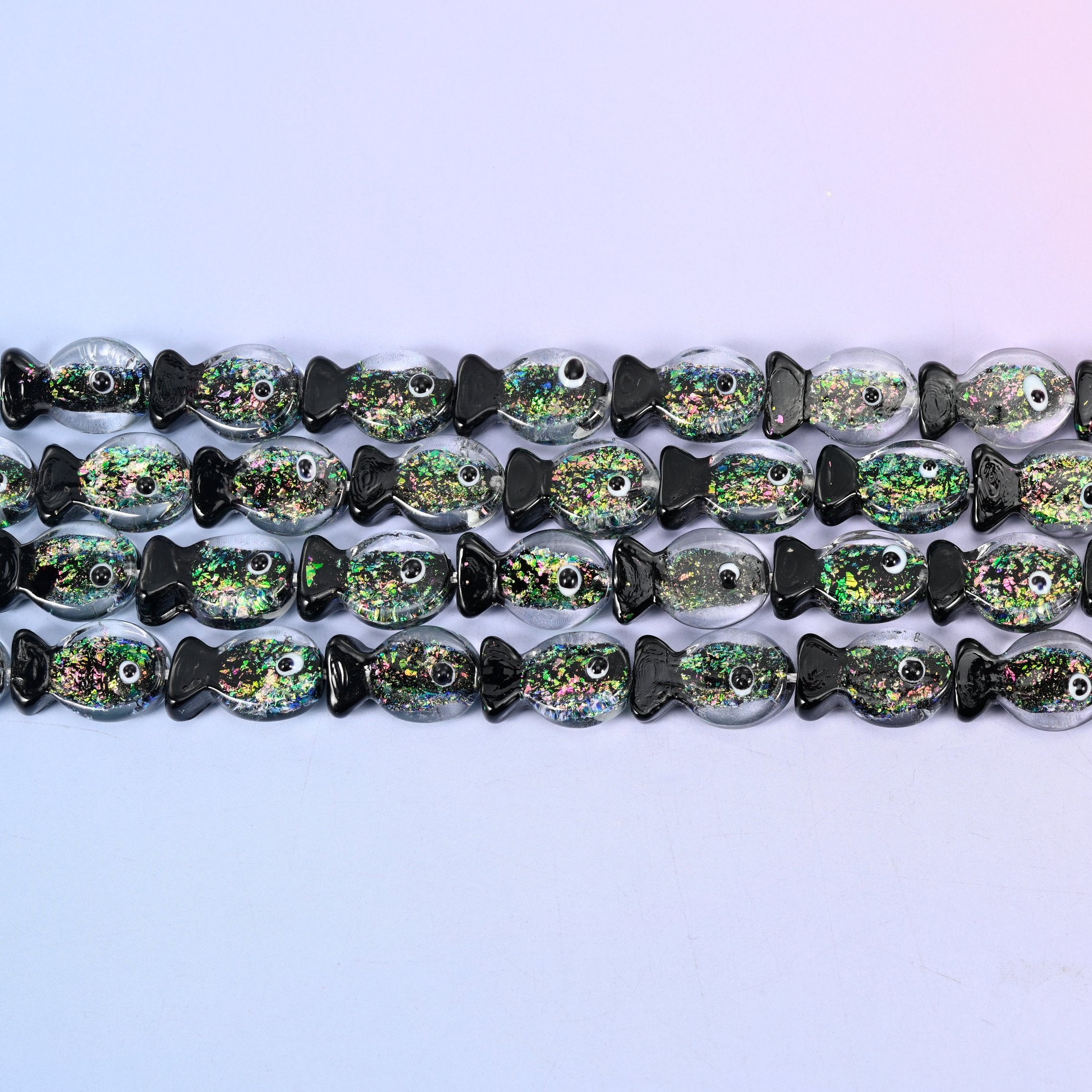 Iridescent Black Green Fish Glass Beads with green and gold glitter core