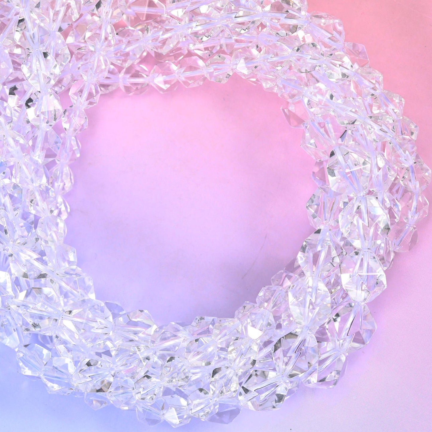 Clear Quartz diamond star cut beads coiled into a tight loop, centre drilled and star faceted