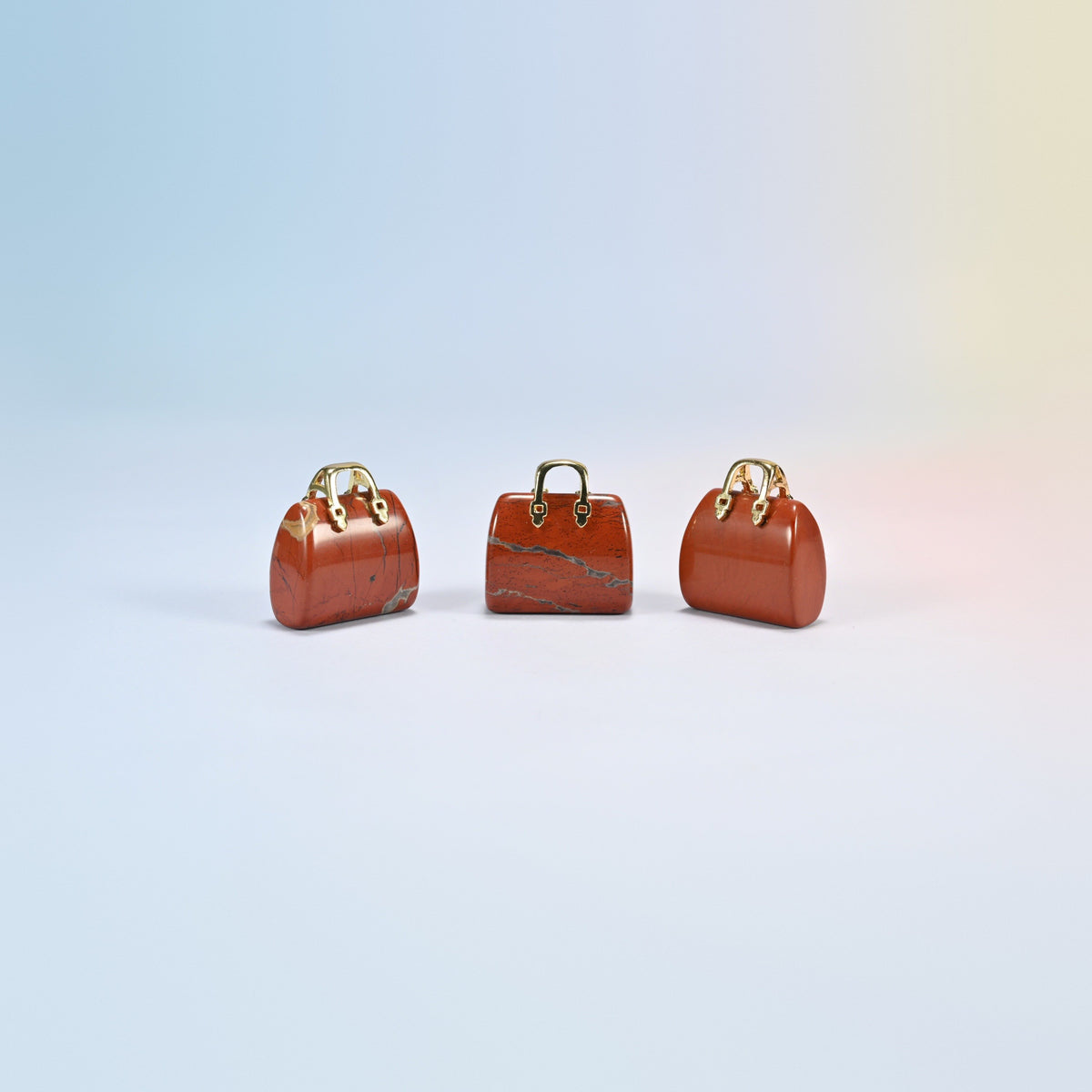 Three red jasper purse crystal carvings, 1 inch, brick red natural stone, gold-tone handle