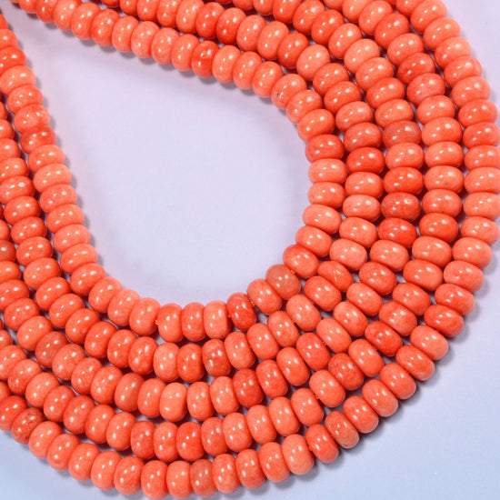Red Orange dyed jade gemstone rondelle beads in a long narrow loop, a 15 inch strand holding about 75 beads