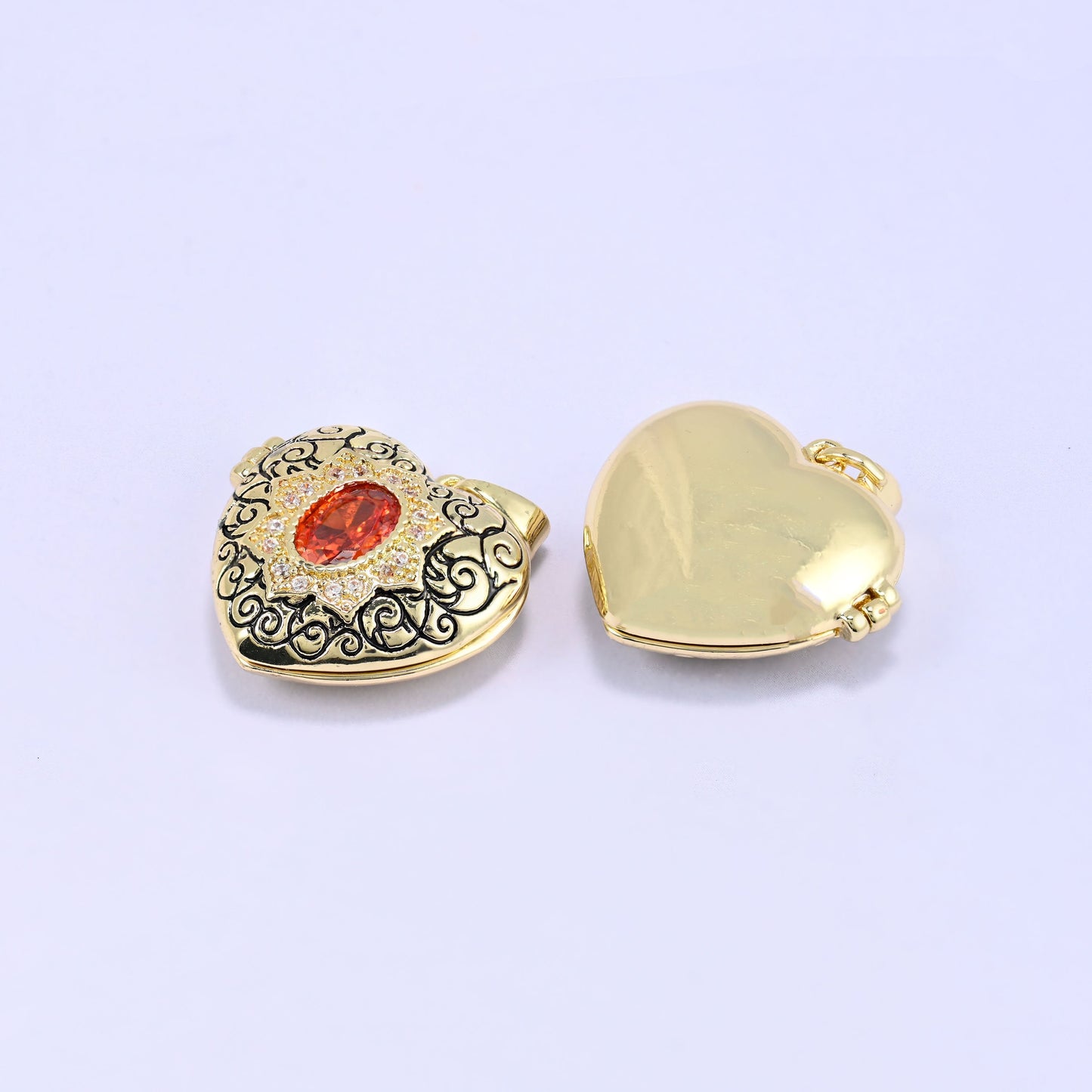 18K Gold Plated Brass Heart Locket Pendant with ornate black filigree scrollwork and red oval zircon centerpiece