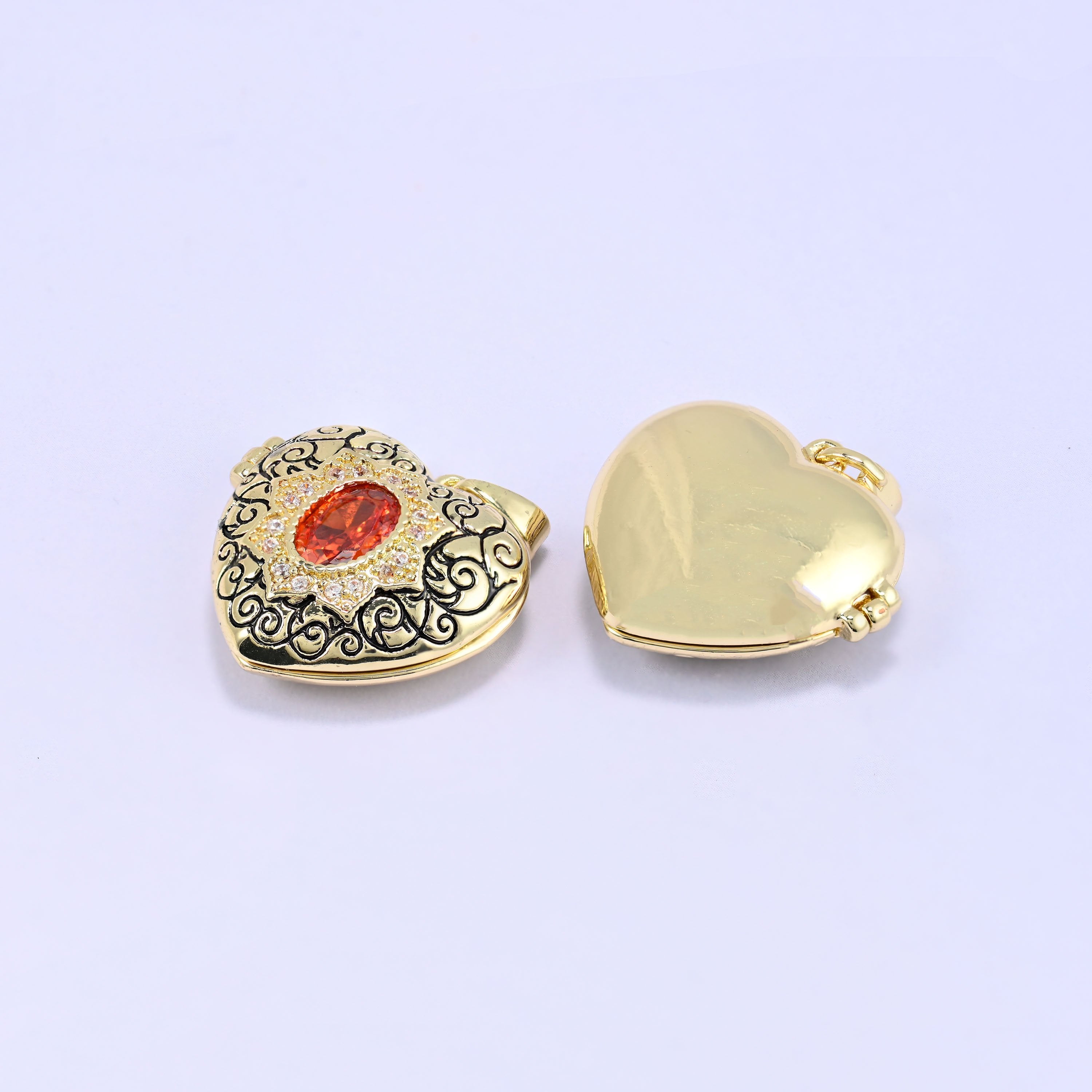 18K Gold Plated Brass Heart Locket Pendant with ornate black filigree scrollwork and red oval zircon centerpiece