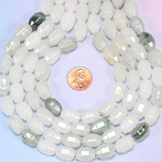 Wide circular coil of Tianshan Jade faceted barrel beads on a light lavender and pink gradient background, showing the full wreath.
