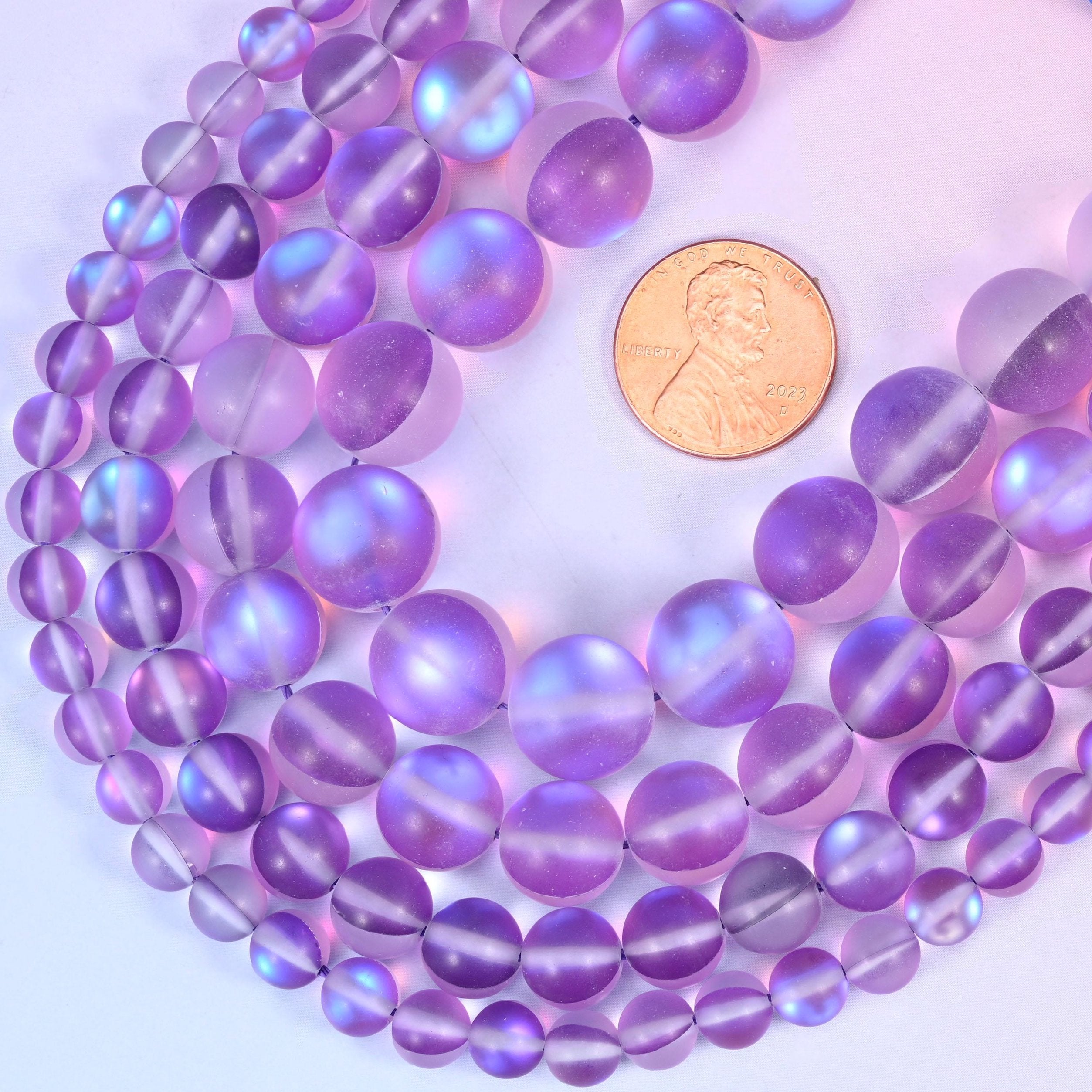 Round frosted purple glass beads with sea-glass surface