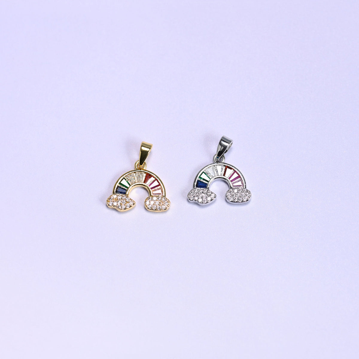 Rainbow Zirconia Charms colorway pair, the warm gold version beside the silver tone version, both with multicolor zirconia arcs.