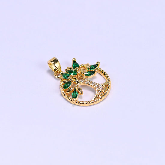 Tree of life charm with a clear zircon pave trunk and an openwork round frame