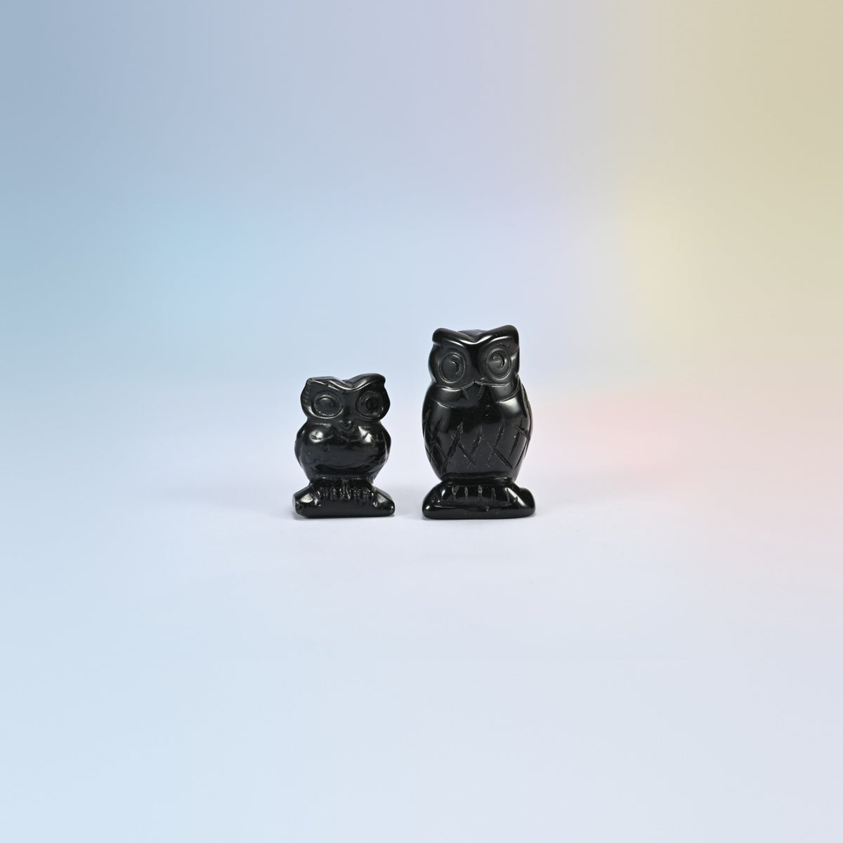 Owl crystal carving in black obsidian, glossy black natural stone