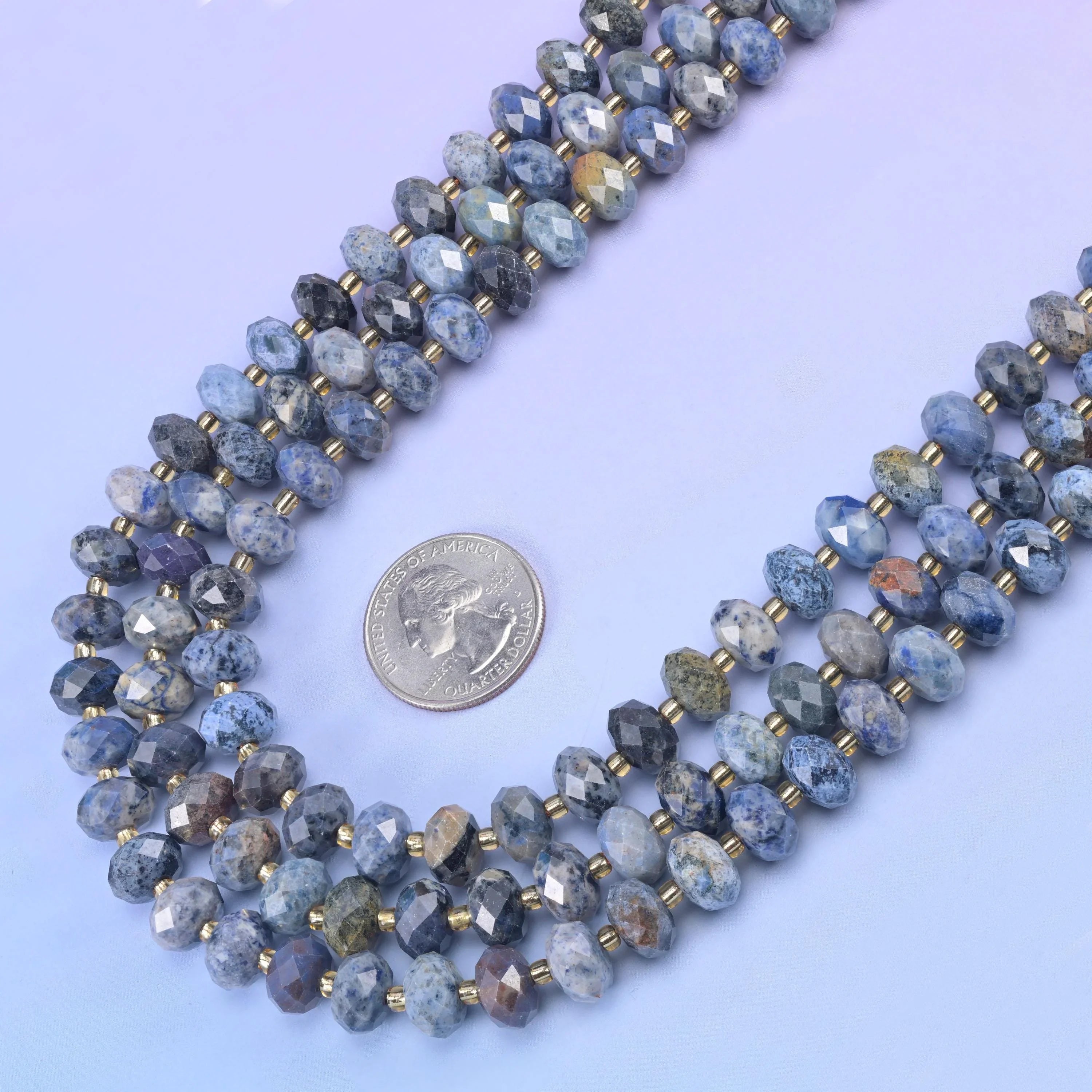 Sunset Dumortierite Faceted Rondelle Beads in denim blue and pale grey with rust-tan patches