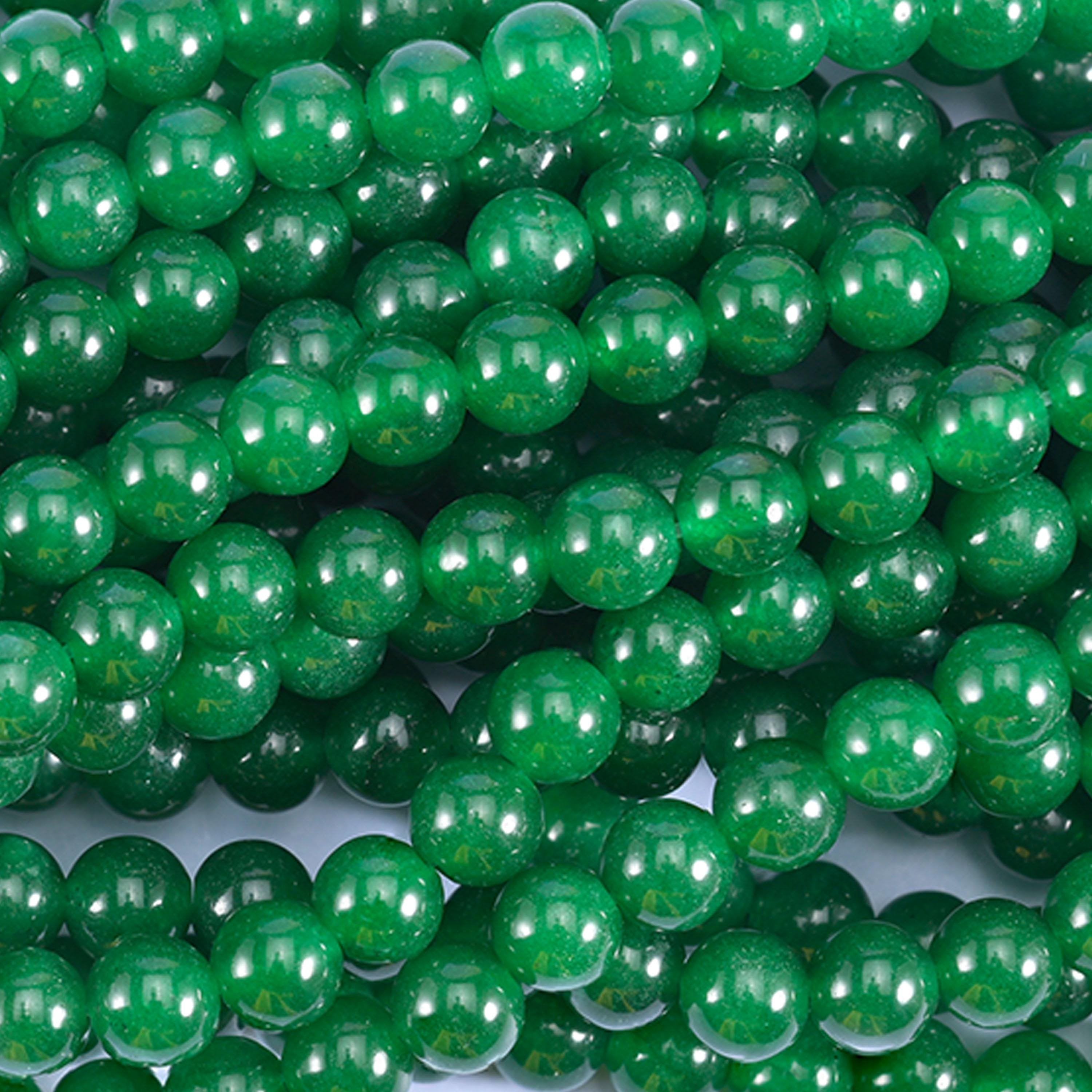 A strong, even emerald green with a glassy polish and just enough depth to look wet under light