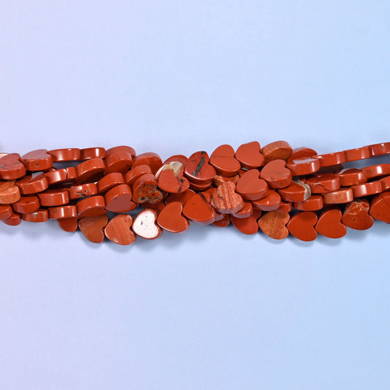 Red Jasper Flat Heart Beads, a solid brick red, opaque and evenly coloured with the odd paler streak