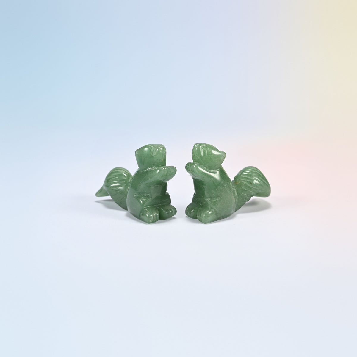 Two 2 inch natural green aventurine long tail squirrel carvings, smooth polished green stone
