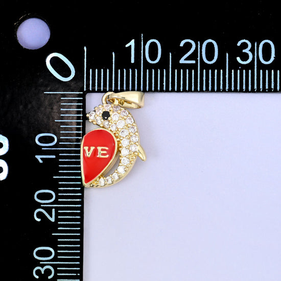 Leaping dolphin curled around a red enamel heart lettered LOVE, set with clear zircon and pale blue enamel