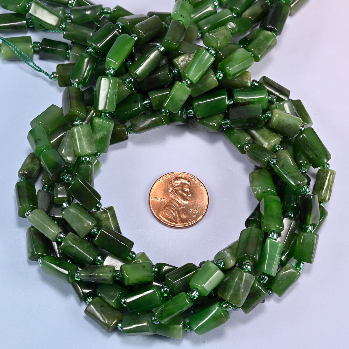 Canadian Green Jade faceted tube beads coiled flat, 8x7mm to 12x7mm natural green nephrite tubes on a 15.5 inch strand