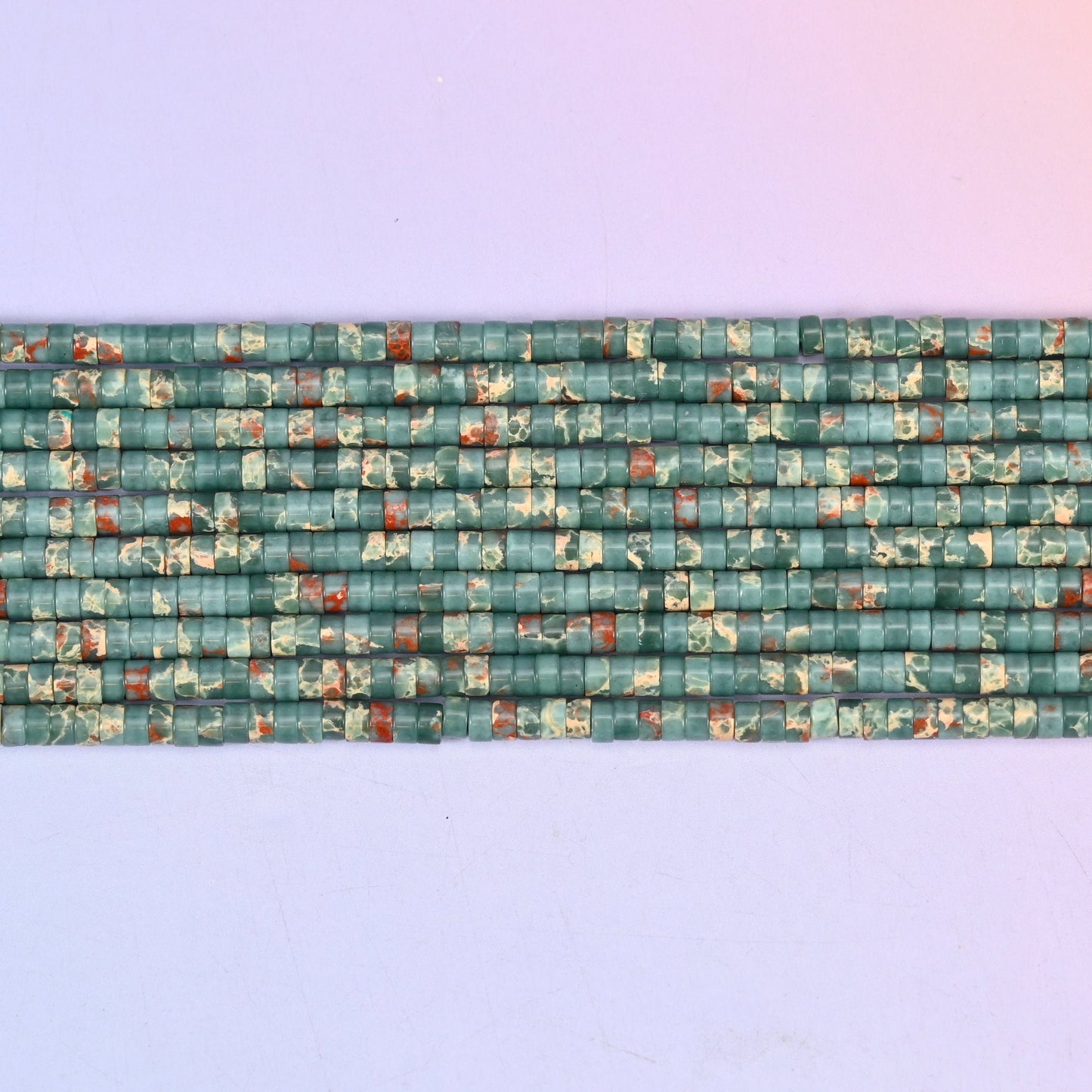 Blue Sea Sediment Jasper Heishi Disc Beads 2x4mm in teal green with rust red and cream mottling