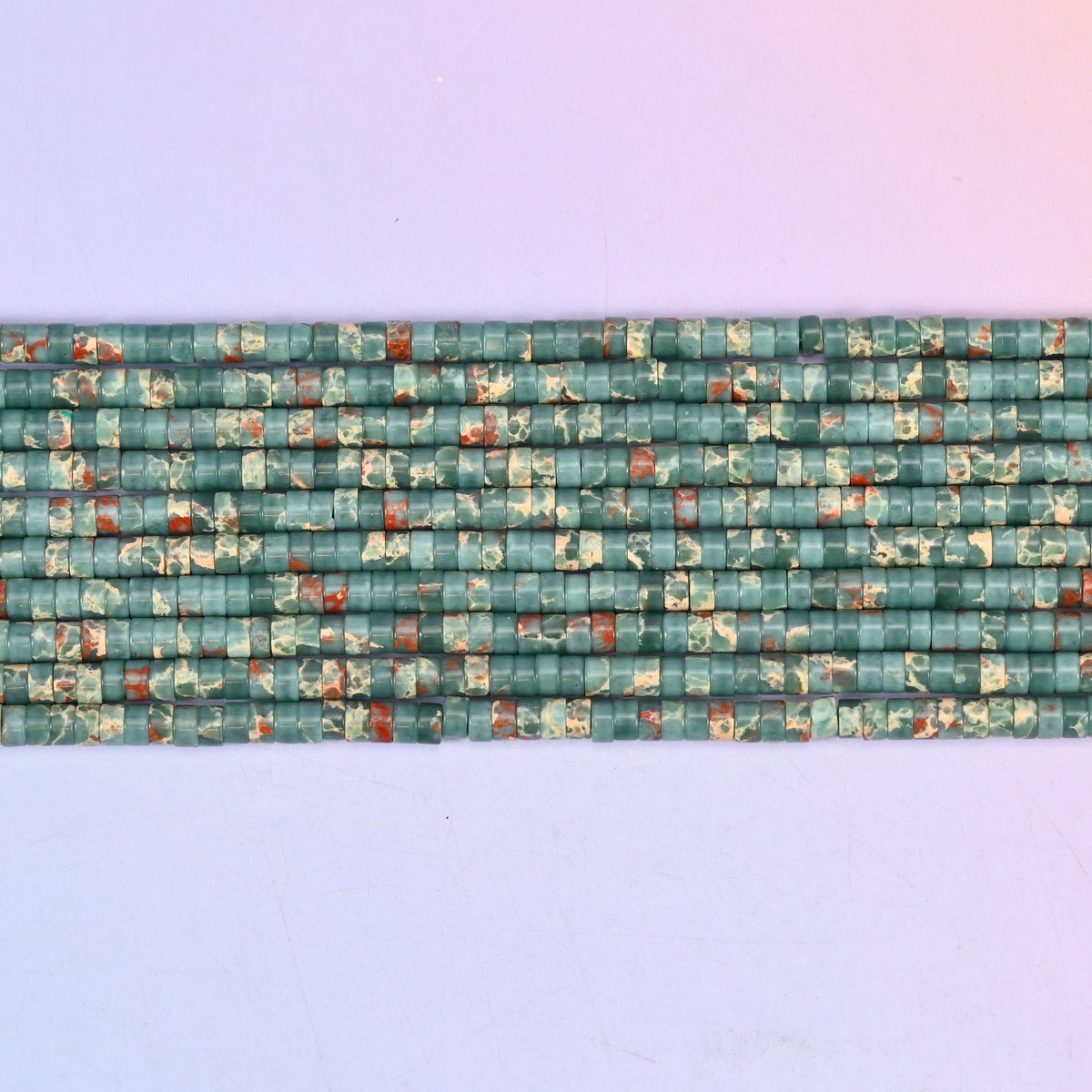 Blue Sea Sediment Jasper Heishi Disc Beads 2x4mm in teal green with rust red and cream mottling