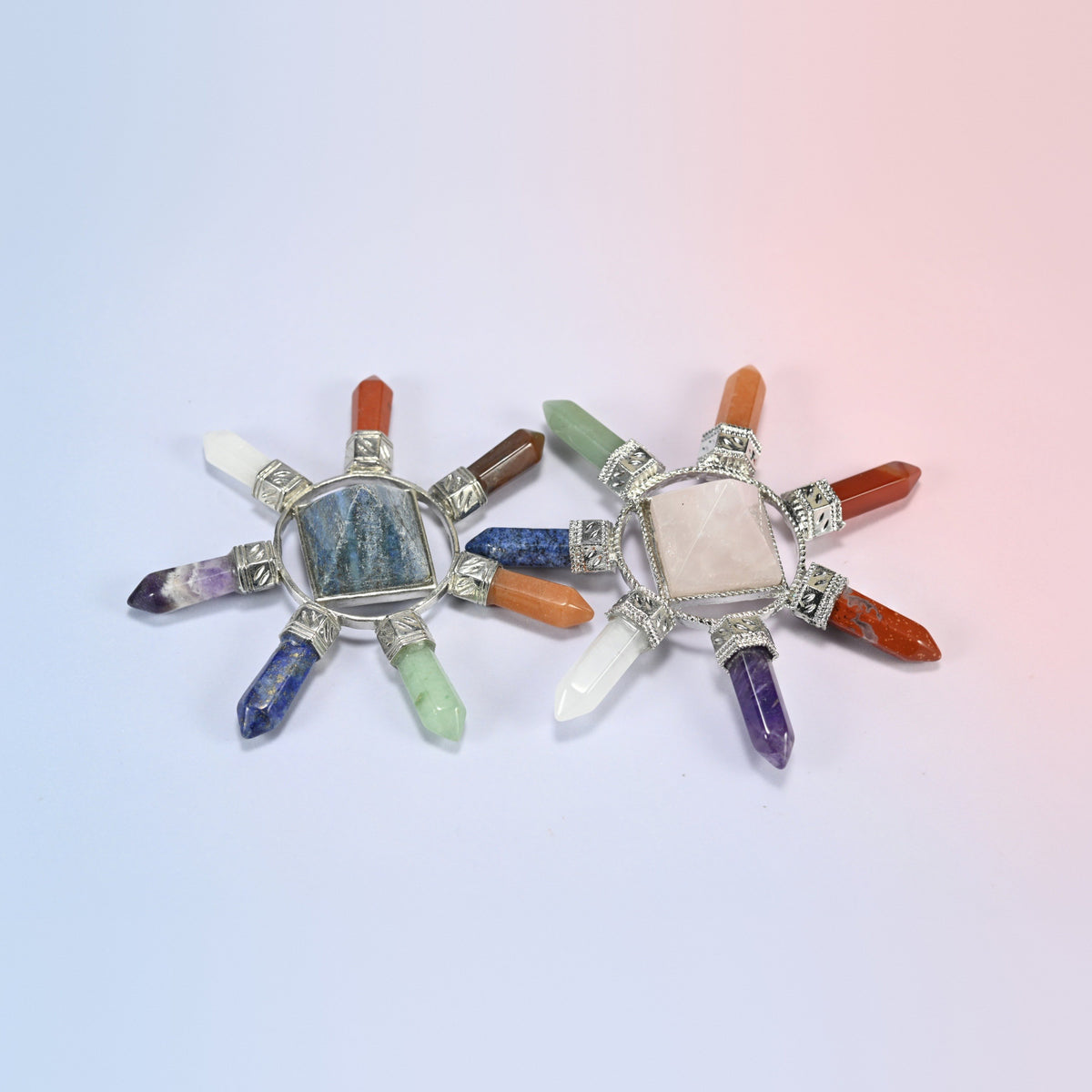 Two crystal energy generators with lapis lazuli and rose quartz center pyramids and seven chakra crystal points each