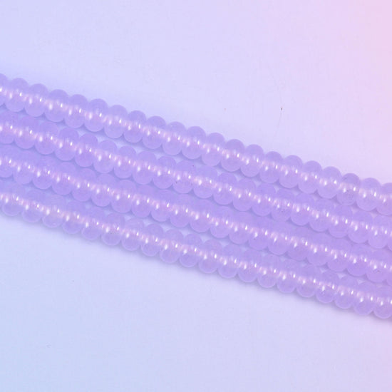 Lavender Purple Dyed Jade beads in a soft, translucent lilac tone