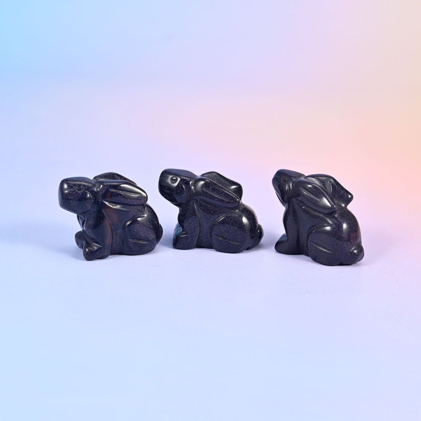 Laying down bunny carving offered in 47 gemstones, from deep green and cream to lilac, coral and blue