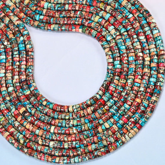 Dyed red blue sea sediment jasper heishi disc beads 2x4mm curved into an open loop, showing the turquoise and red mix across whole strands