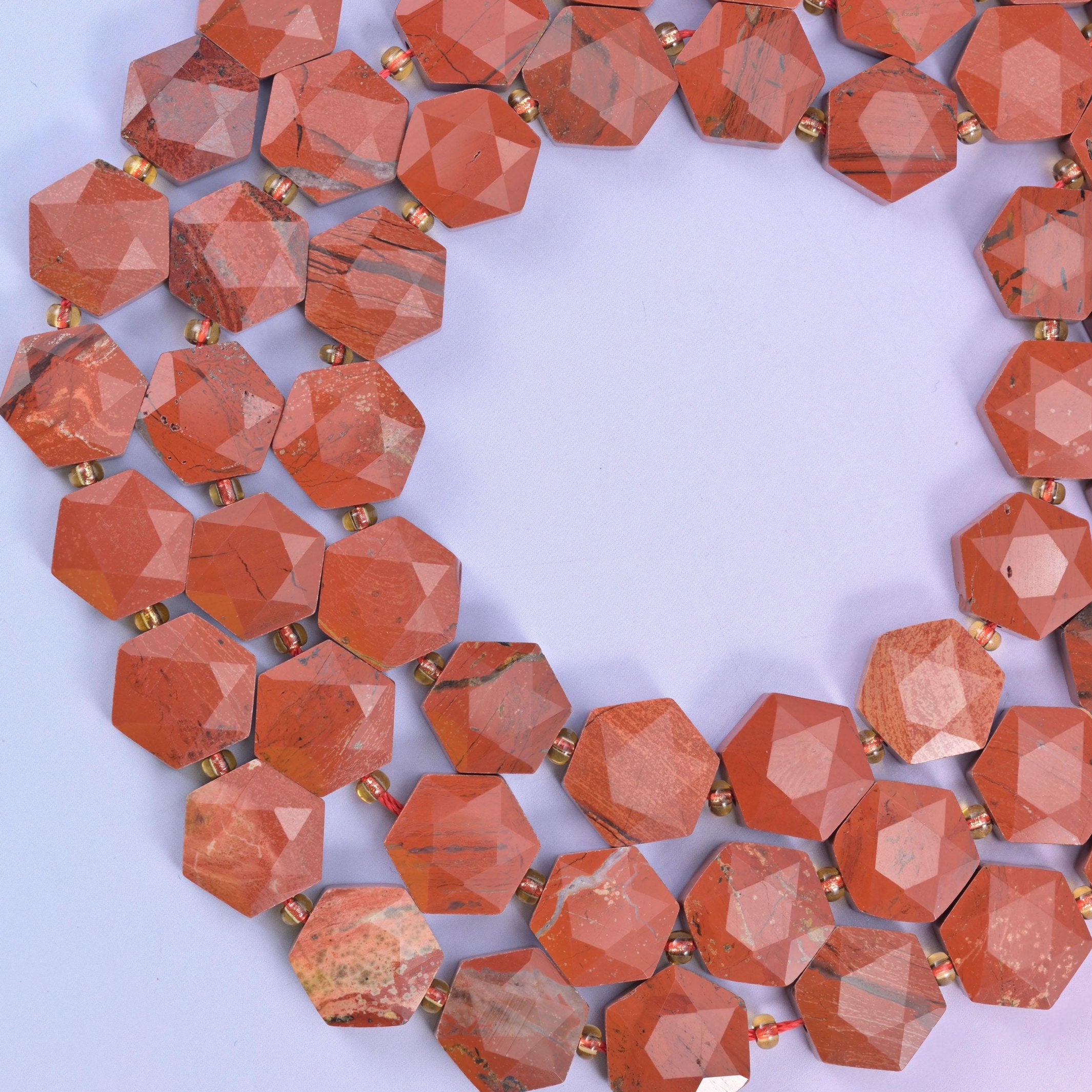 Red Jasper hexagon beads, approximately 27 beads per strand