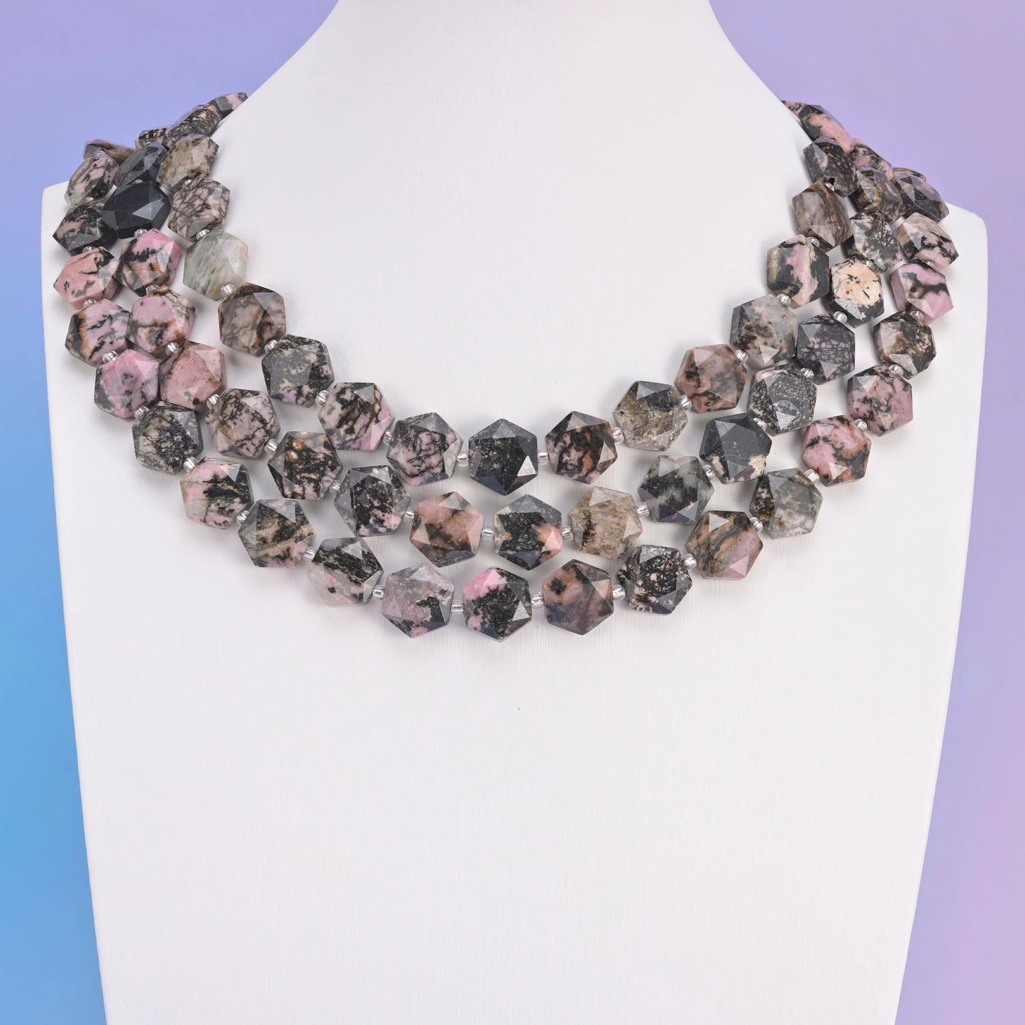 Rhodonite in dusty rose pink laced with black manganese veining.