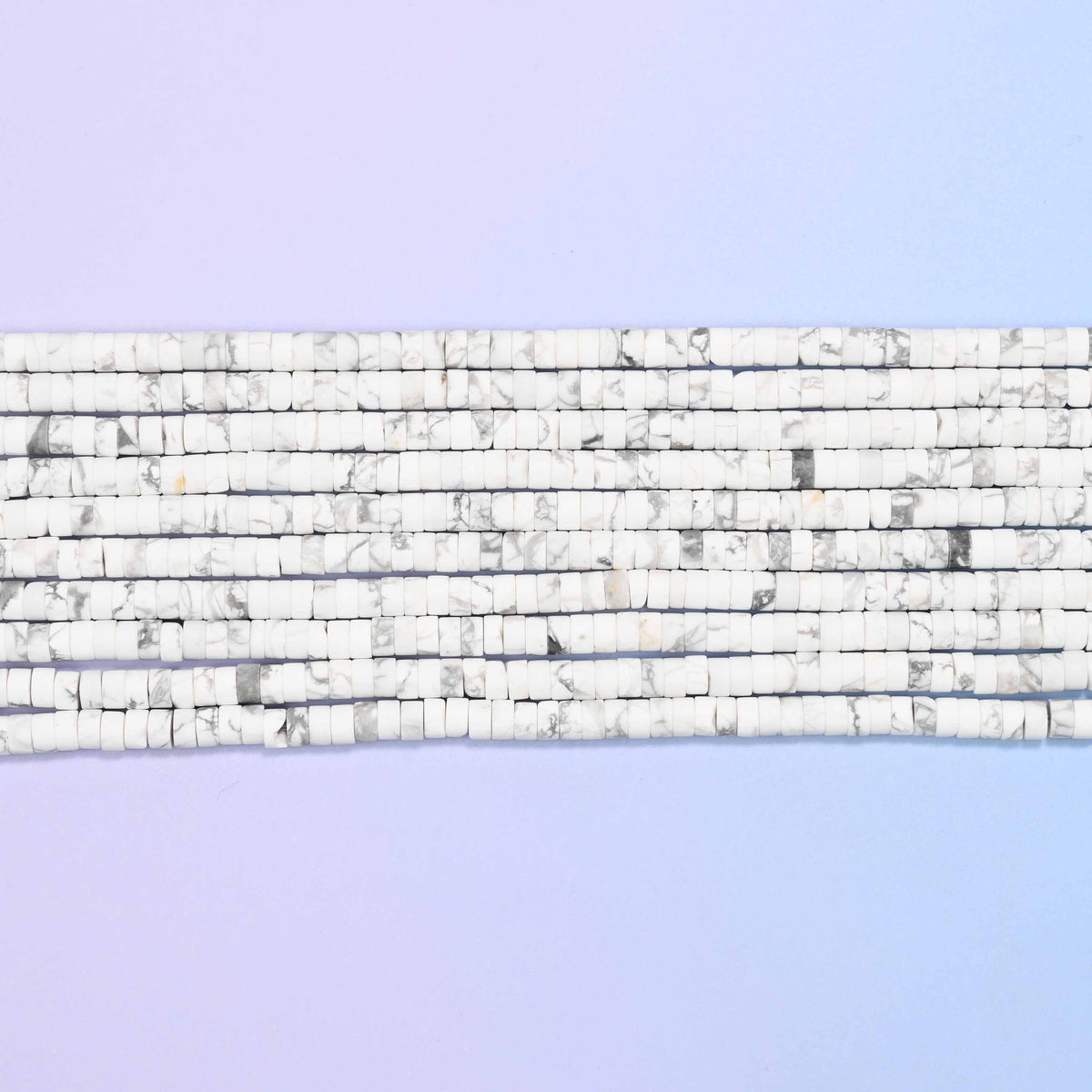 White howlite beads in soft white with subtle grey veining