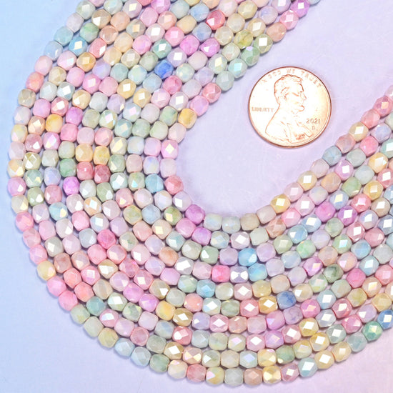 Faceted barrel cut glass beads as delicate spacer beads.