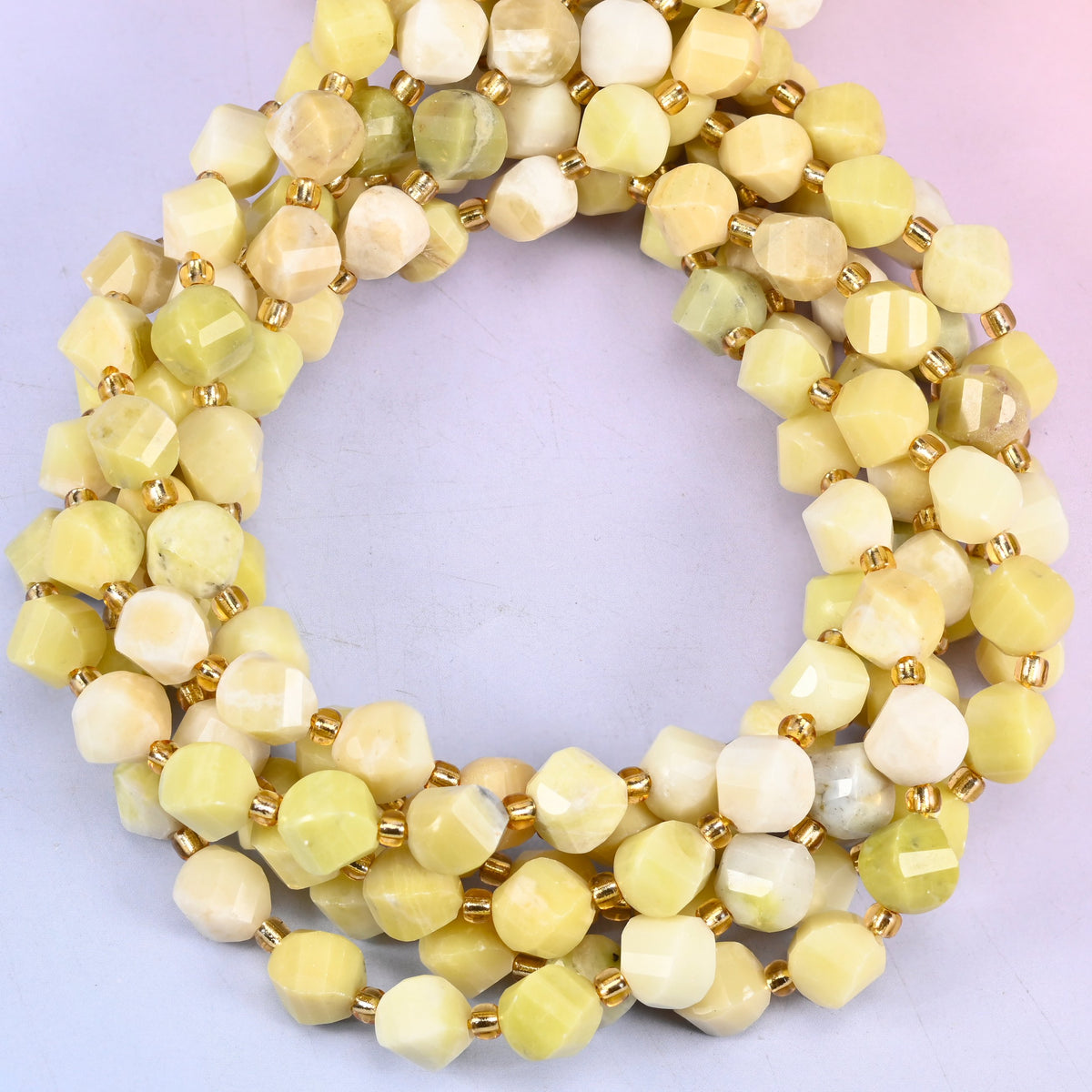 Natural lemon jade beads in an 8mm faceted spiral twist cut