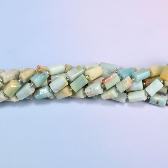 Close-up of Multi-Color Amazonite faceted tube beads showing the flat cut planes, polished surface and clear glass seed bead spacers