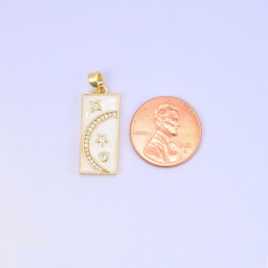 Brass rectangle charm with moon and star design and sparkling zircon accents