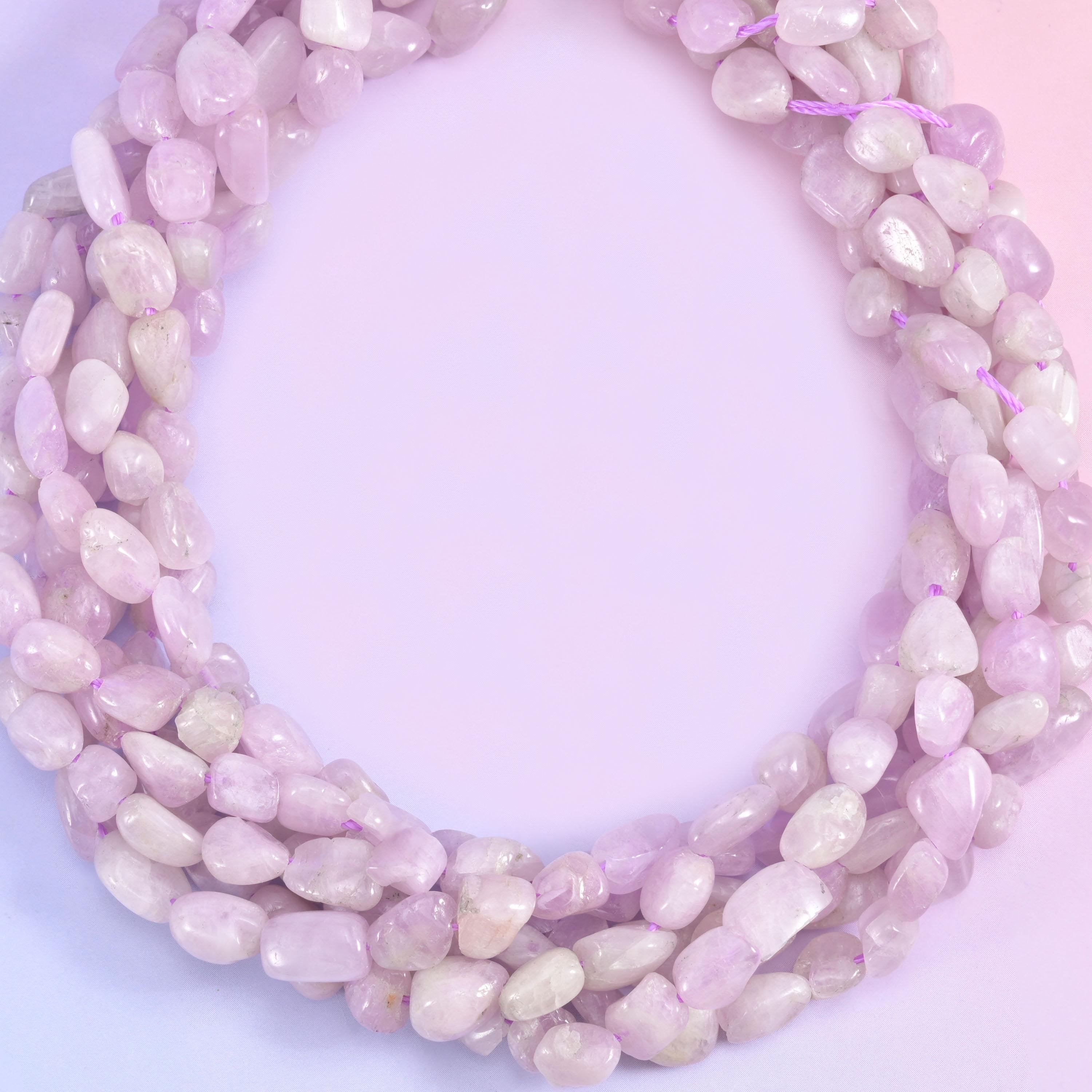 Pale lilac and blush pink stone, part frosted and part clear enough to catch light through the bead