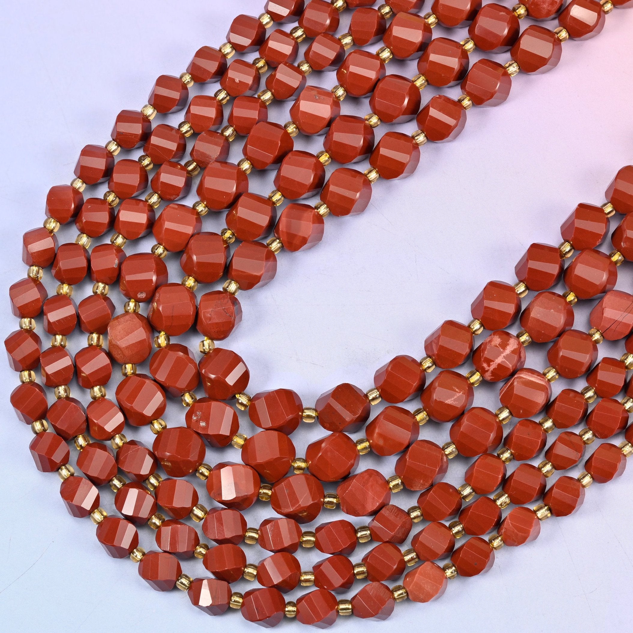 Red Jasper Faceted Spiral Twist Beads, sold per 15 inch strand.