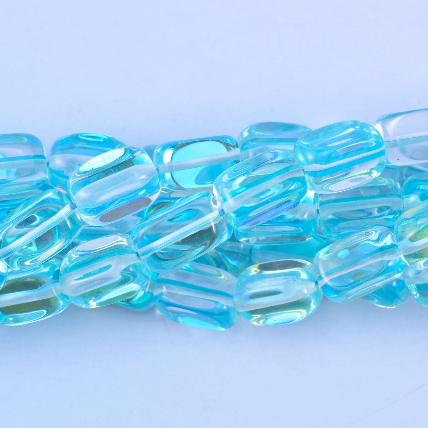 Rectangular cut light blue mystic aura glass beads