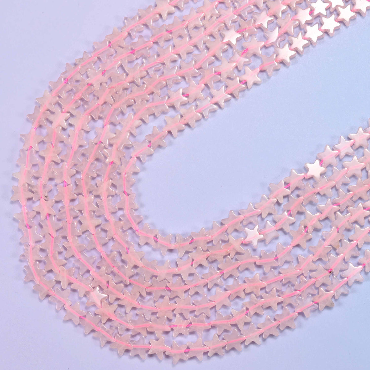 Rose quartz flat star beads, 15 inch strand