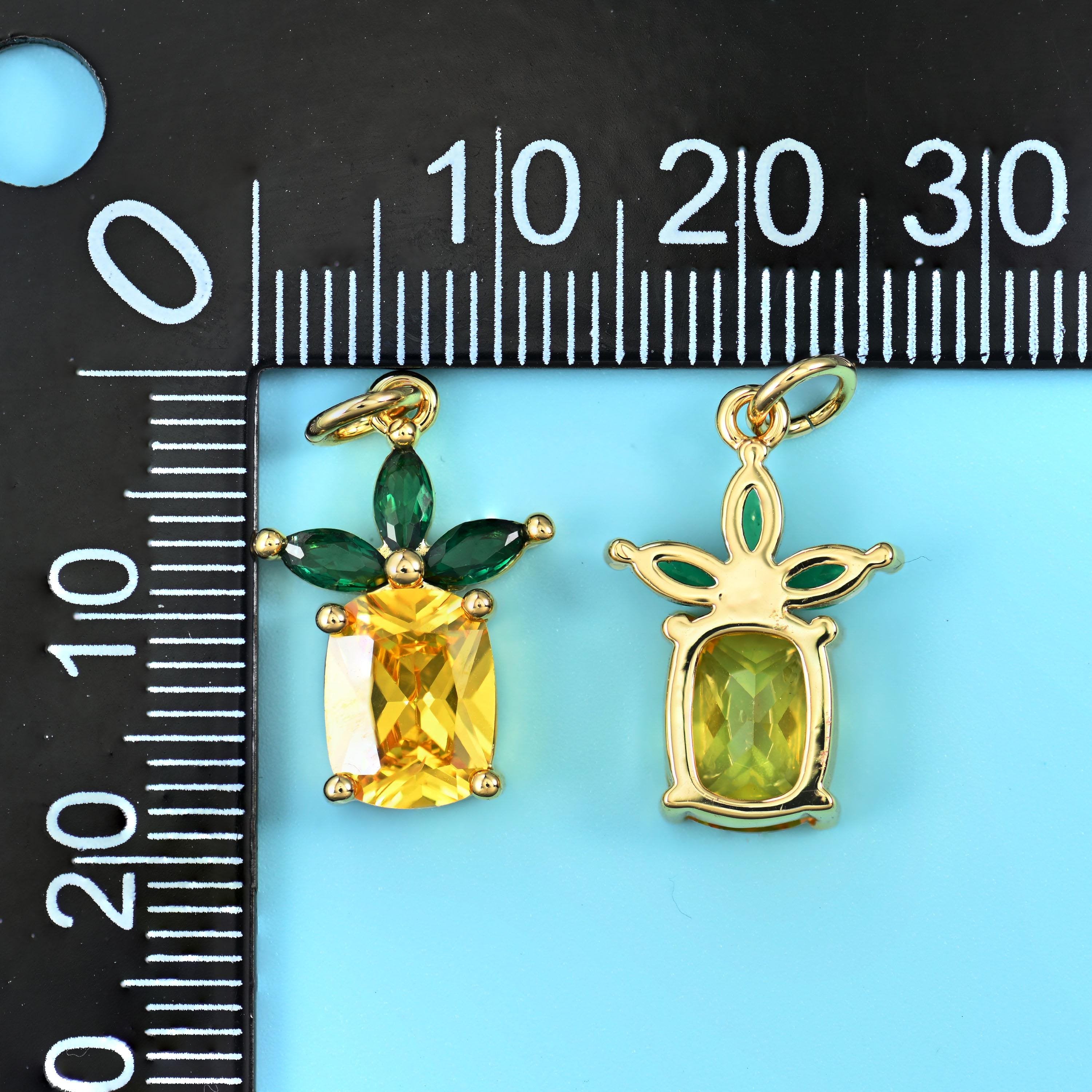Emerald-cut lemon yellow zircon set as the fruit with green marquise-cut zircon leaves
