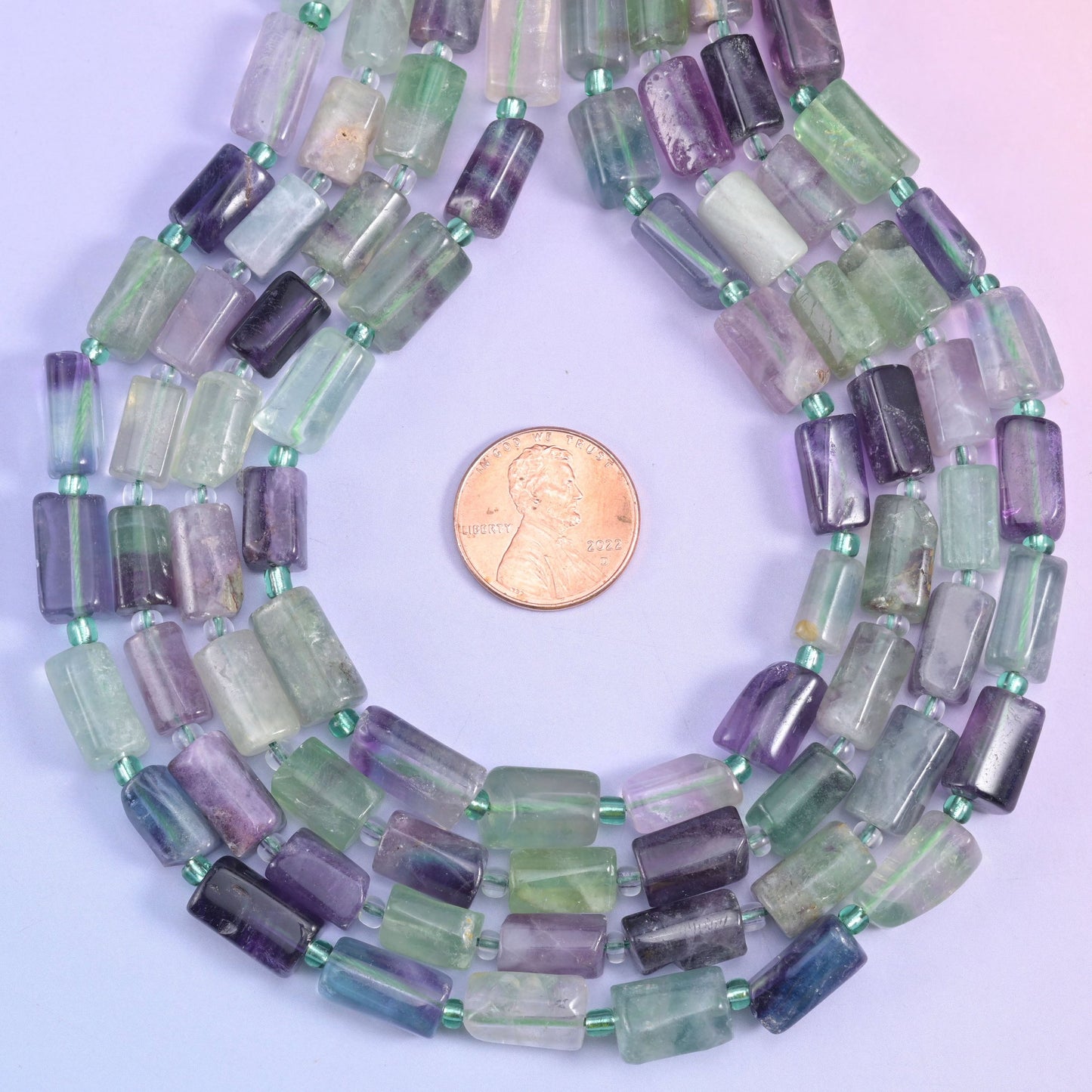 Natural Multi-Color Fluorite faceted tube cylinder beads with striking color combinations from pastel to bold, vibrant hues.