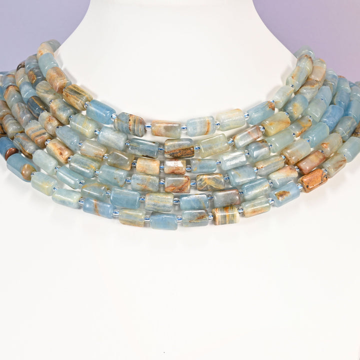Blue Calcite faceted tube beads in soft sky blue and aqua tones.