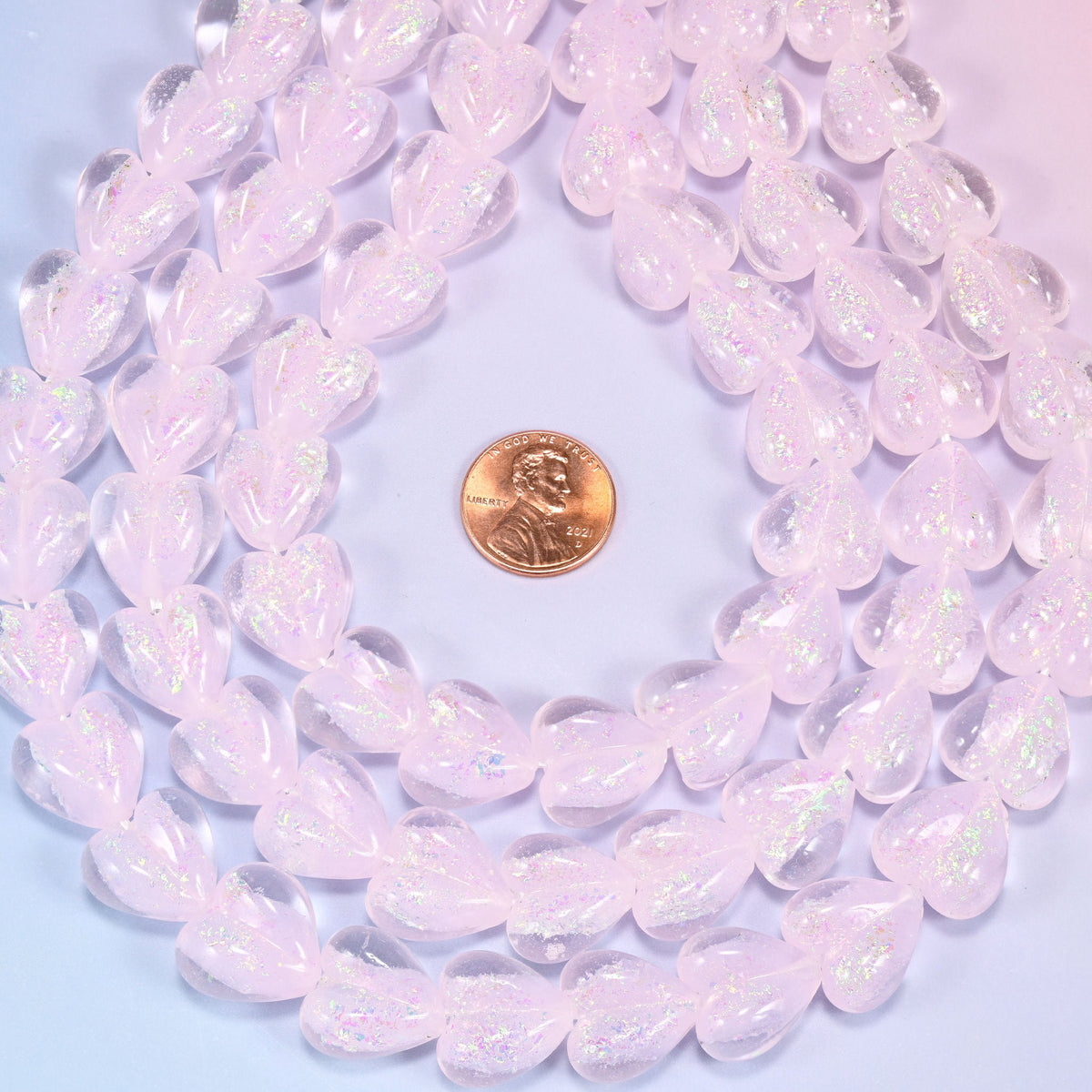 Milky pale pink glass heart beads with frosted opalescent surface