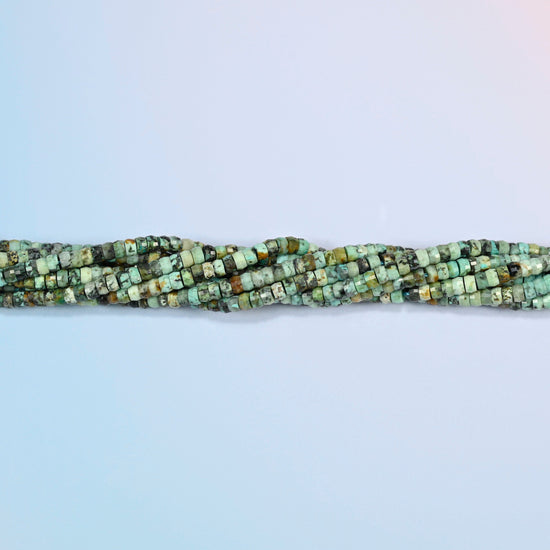 Strands of African howlite faceted heishi disc beads twisted together in a horizontal row
