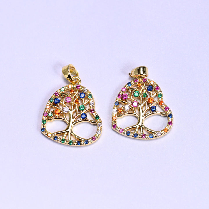 Two 18K gold plated heart tree of life zirconia charms side by side, the openwork tree framed by multicolour zirconia around the heart.
