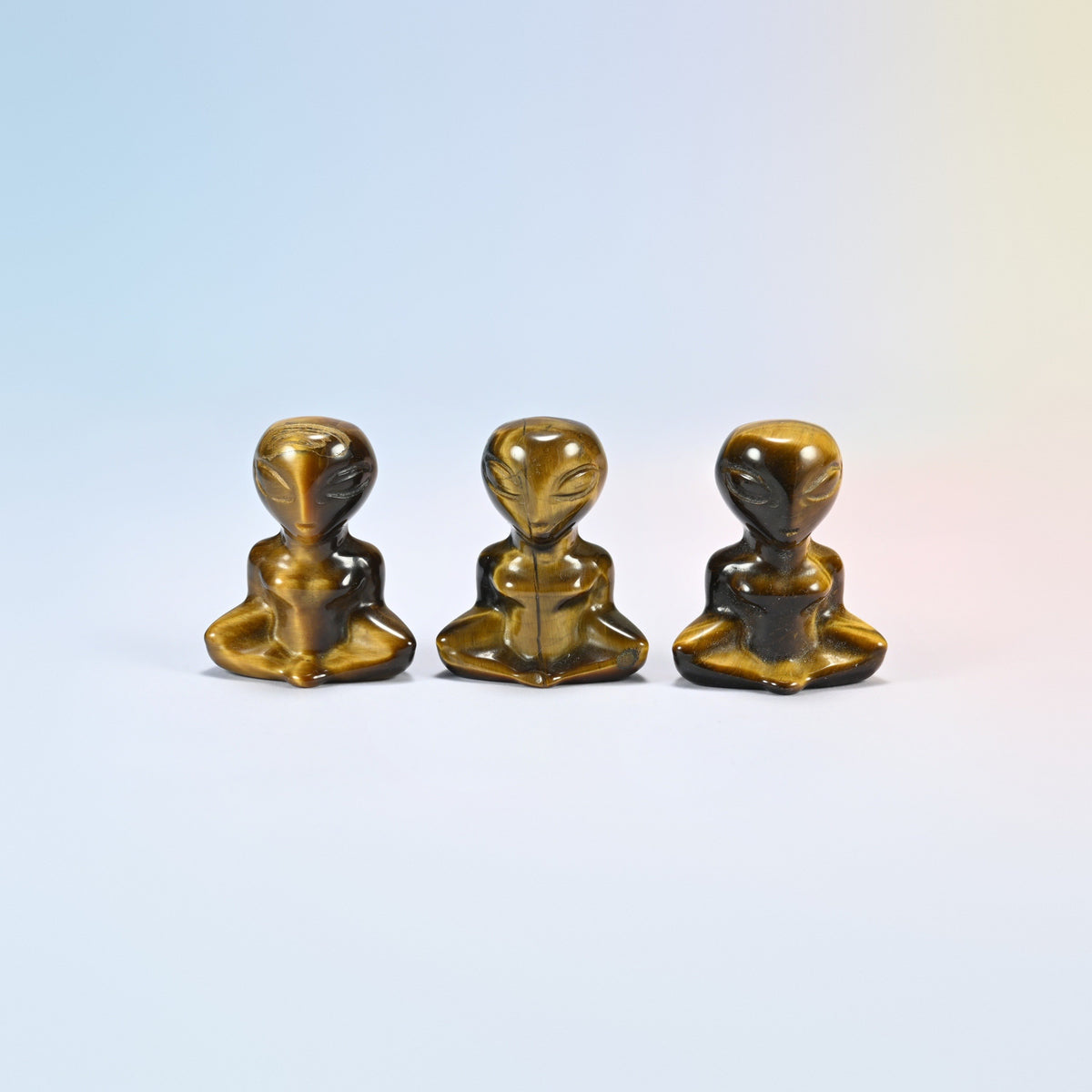 Three natural tiger eye yoga alien crystal carvings, 1.5 inch, golden brown